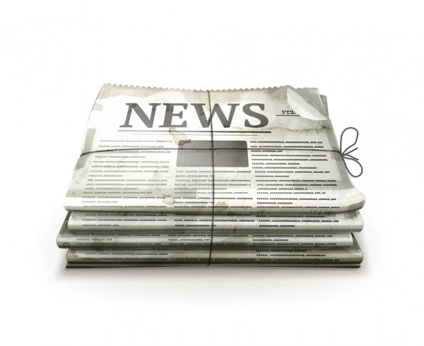 Illustration of a bundle of old newspapers tied with string
